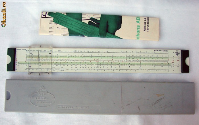 Rigla de calcul  germana marca Faber Castell prevazuta cu cutie de protectie si carte foto mare